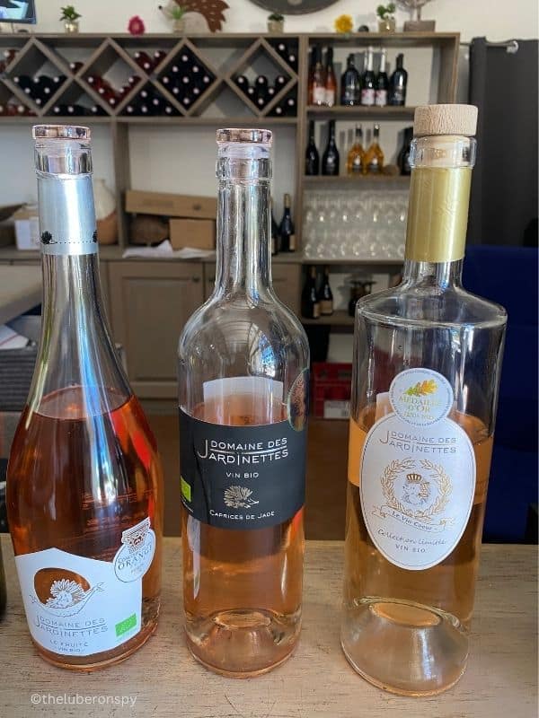 Three bottles of pink rośe Luberon wine. The brand is Domaine des Jardinettes, a family vineyards in Luberon.