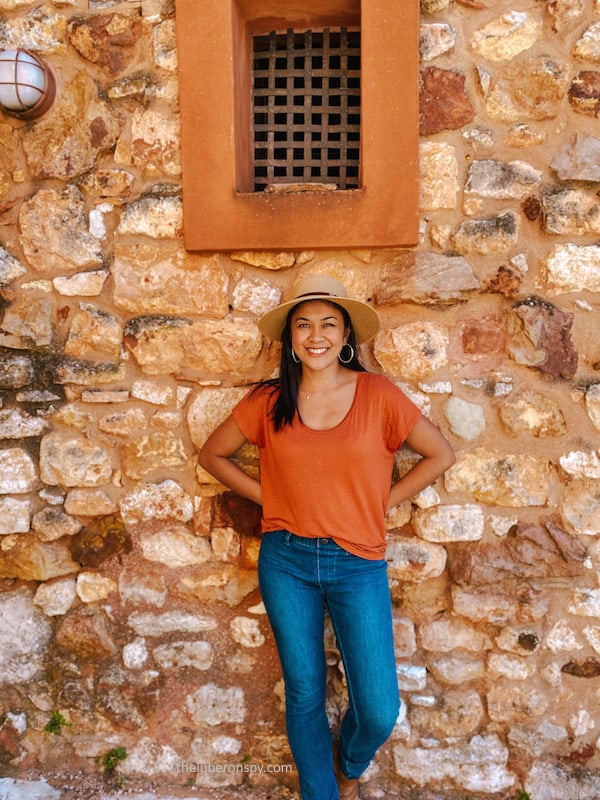 The writer's orange shirt and bright smile match the happy, ocher colors of Roussillon.