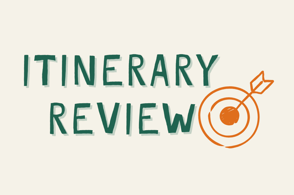 Hand-drawn graphic reading “Itinerary Review” in green lettering with an orange target and arrow on a cream background.