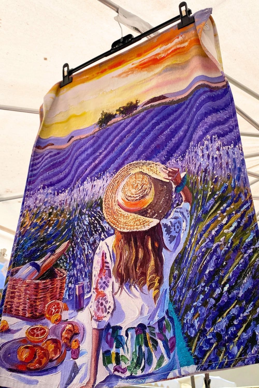 Colorful market cloth featuring a painted lavender field, picnic scene, and sunset landscape inspired by lavender Provence.